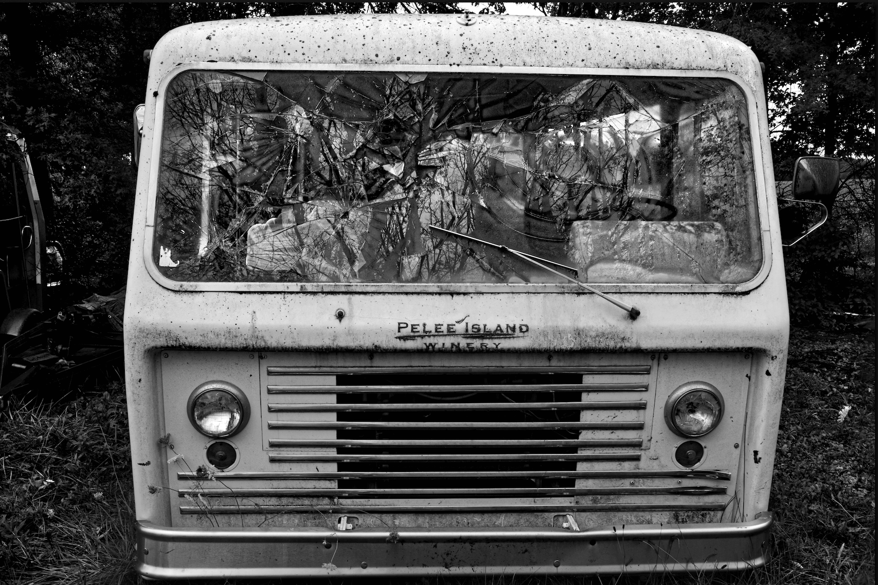 a close up of an old bus that was used for target practice.