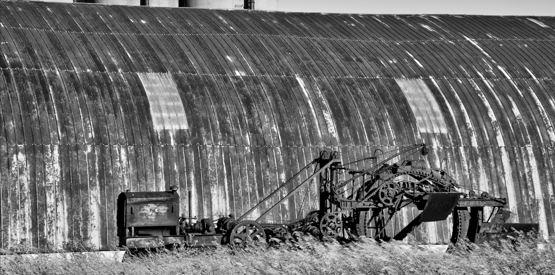 an old trenching machine in a farmers field