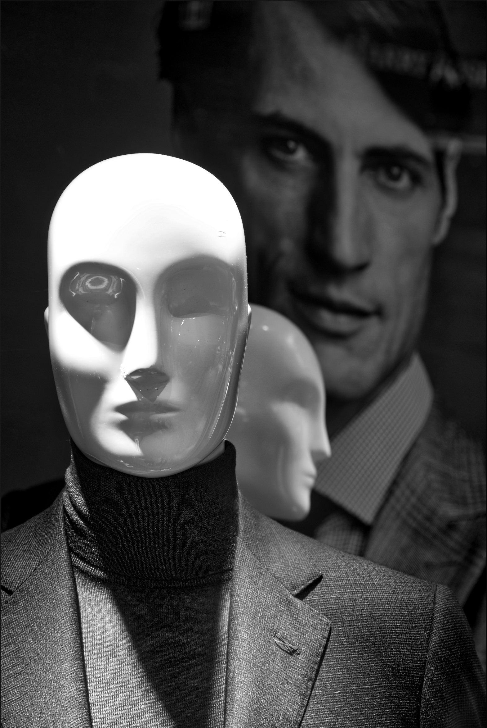 Black & white closeup photograph of a male mannequin