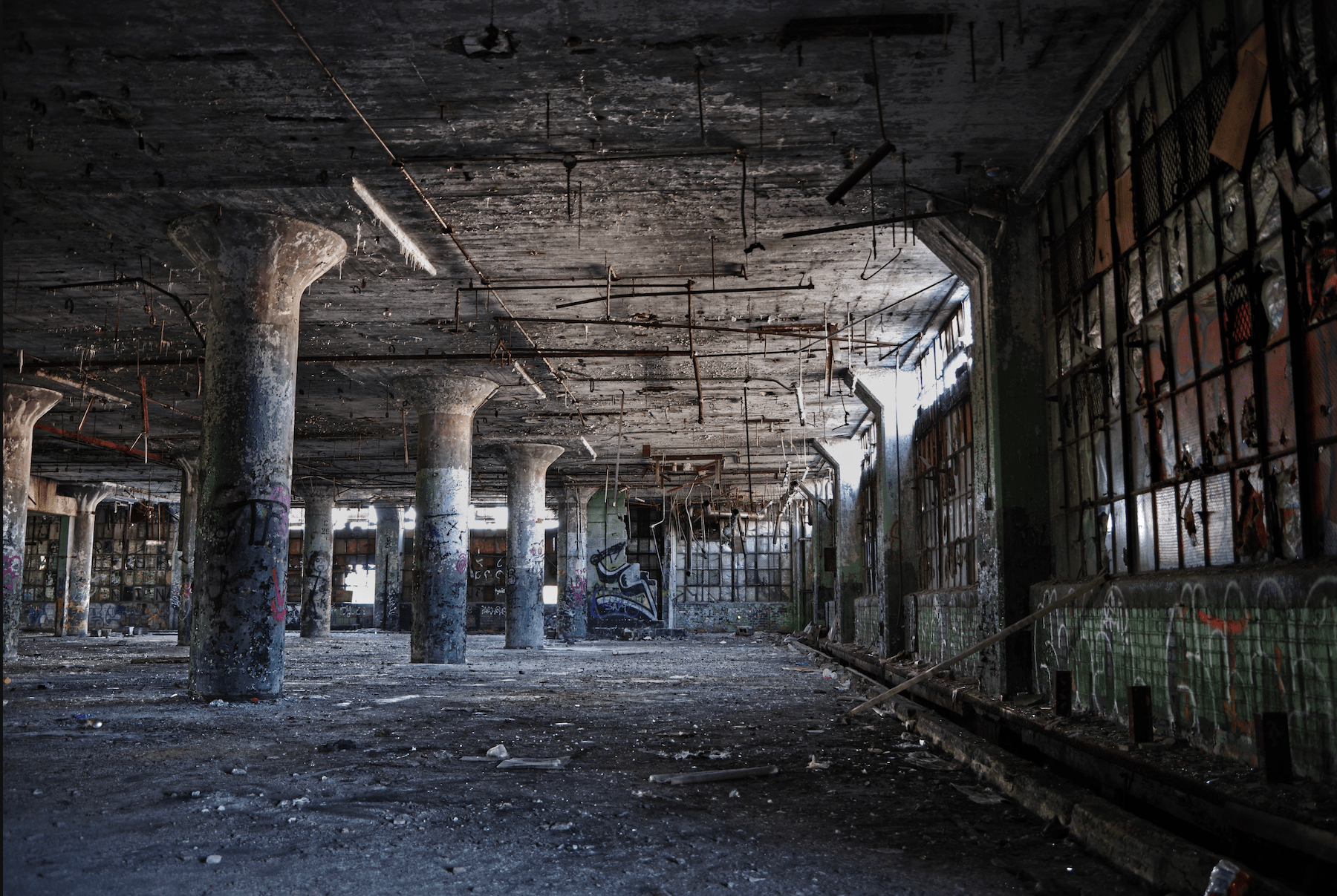 Inside color photograph showing amazing graffiti in the old packard plant in Detroit.