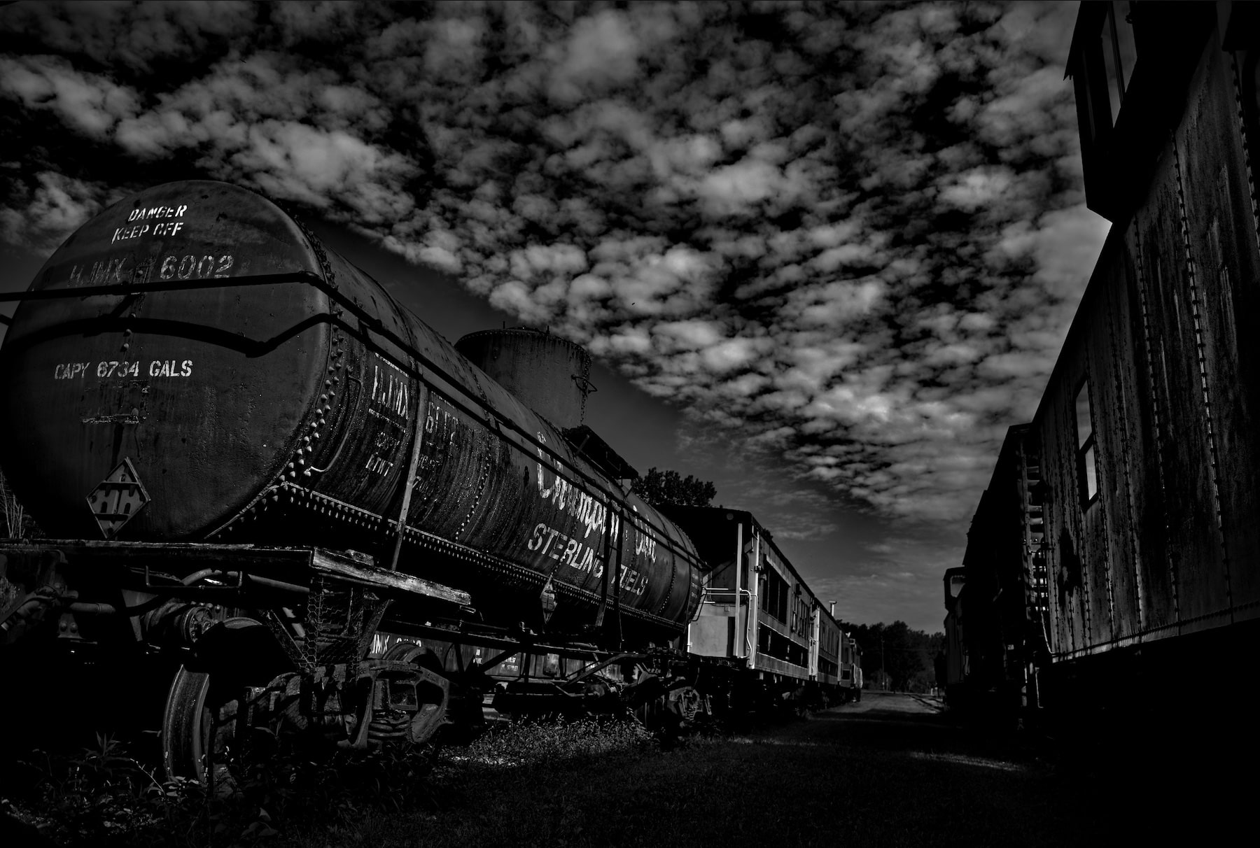 2 old trains side by side at a museum layout