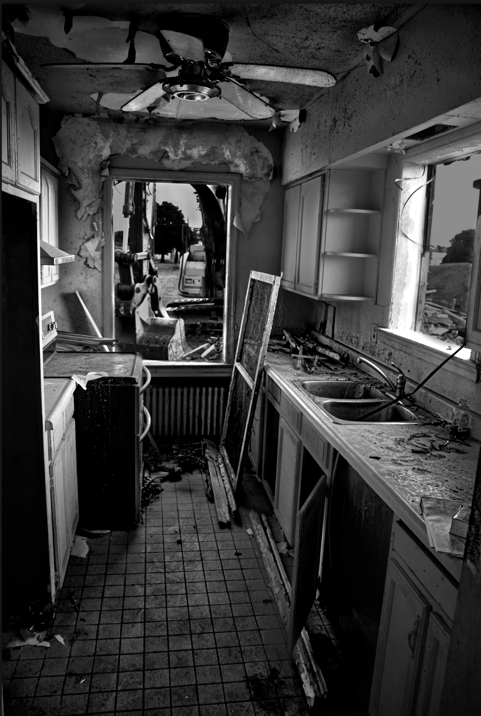 a photograph of a kitchen which is under demolition