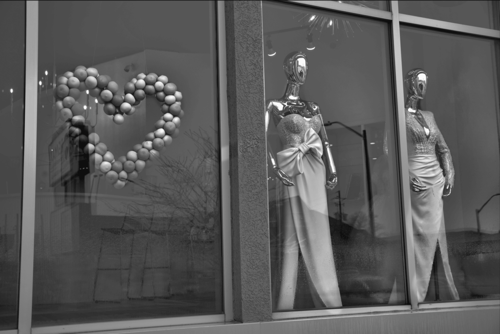 chrome mannequins in a storefront for valentines day